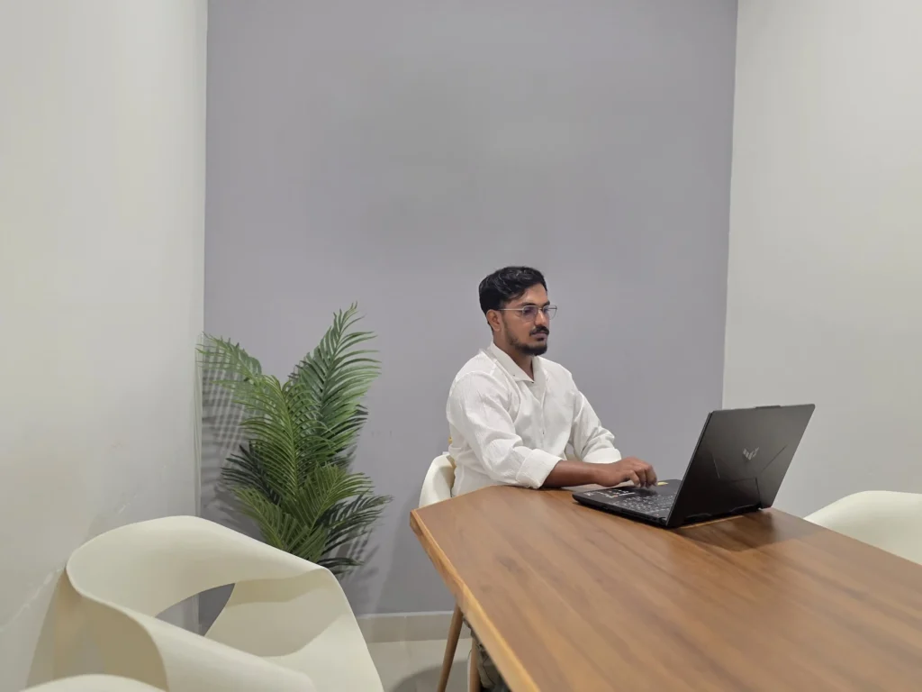 freelance SEO expert in Kerala working in front of laptop